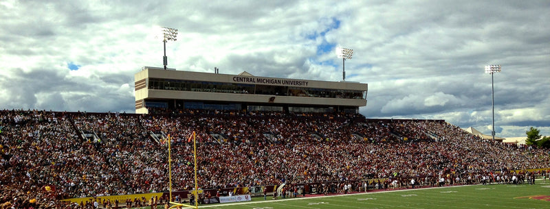 Kelly/Shorts Stadium in Mount Pleasant, its west stands full and the press box marked Central Michigan University