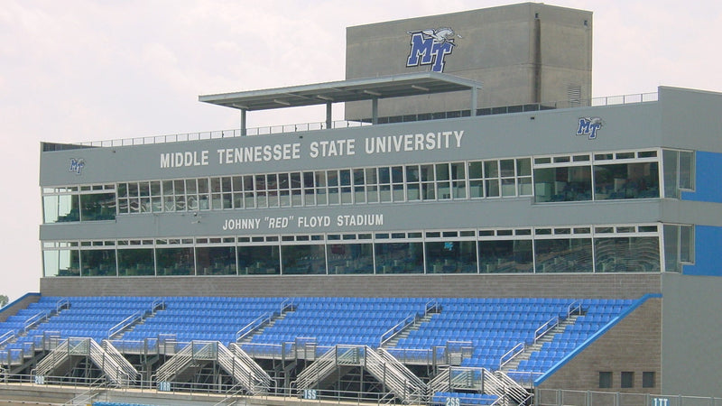 The press box at Johnny Red Floyd Stadium in Murfreesboro, with Middle Tennessee State University in large letters above blue seats