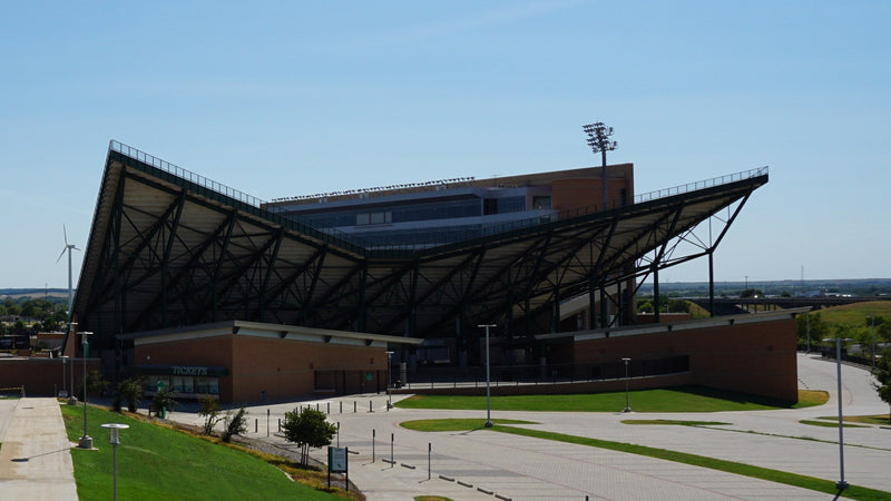 The DATCU Stadium grandstand and ticket windows seen from the walkway on The Hill in Denton