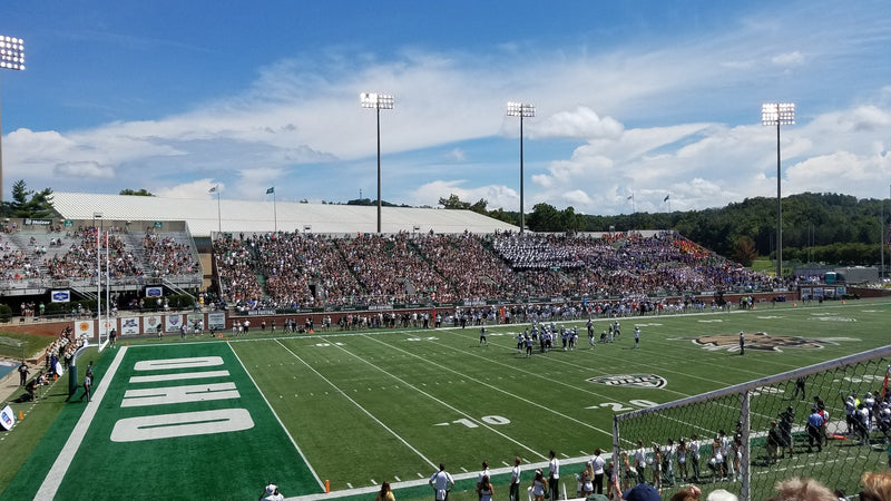 Peden Stadium in Athens during a 2018 game, seen from the stands with the green hills behind