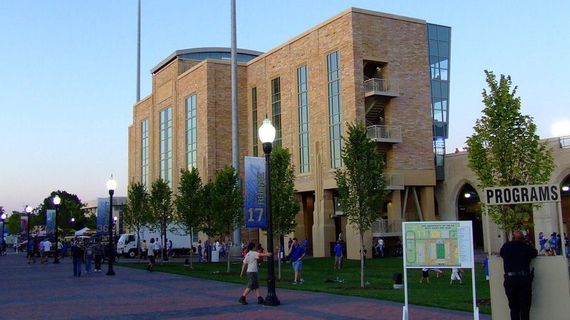 The brick exterior of H.A. Chapman Stadium on the University of Tulsa campus on a game evening