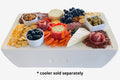 Load image into Gallery viewer, Charcuterie spread of meats, cheeses, crackers, olives, grapes and carrots on white boards atop a white cooler