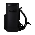 Load image into Gallery viewer, Side view of the all-black backpack cooler showing a side grab handle and the shoulder straps
