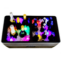 Load image into Gallery viewer, Cooler with wine and beer bottles on ice glowing with multicolor light-up ice cubes, shot from above in the dark