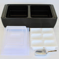 Load image into Gallery viewer, Black two-compartment cooler with a clear dome lid, three white divided condiment trays and an aluminum scoop on white
