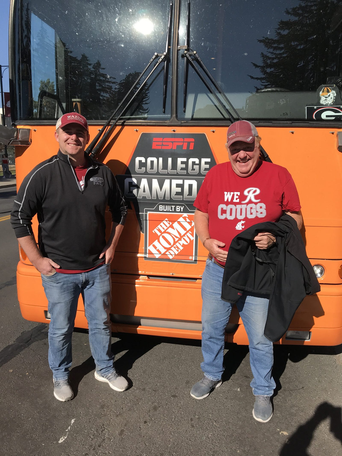 Rusty and his dad at the College GameDay bus in Pullman