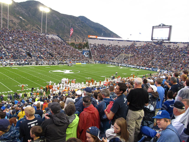 Full stands at LaVell Edwards Stadium in Provo, with the Wasatch Mountains behind