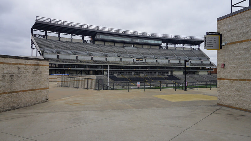 The stands at ASU Stadium in Montgomery, Alabama, seen from the open plaza at the north end
