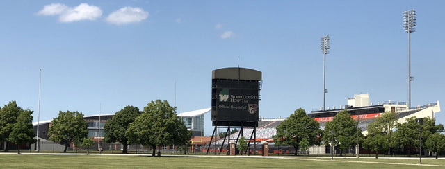 Doyt L. Perry Stadium in Bowling Green, seen across the grass with its scoreboard and light towers