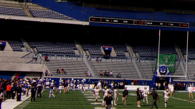 Pregame warmups on the field inside the Georgia State football stadium in Atlanta, with the north stands behind