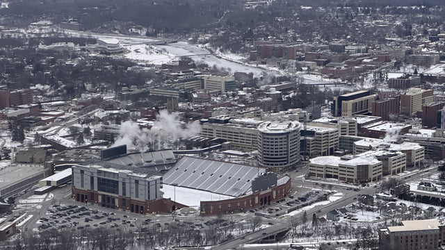 Aerial view of Kinnick Stadium in winter, next to the University of Iowa Stead Family Children's Hospital