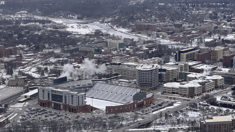 Aerial view of Kinnick Stadium in winter, next to the University of Iowa Stead Family Children's Hospital