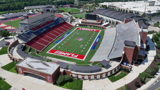 Aerial view of Williams Stadium and its brick entrance gate on the Liberty University campus in Lynchburg, Virginia