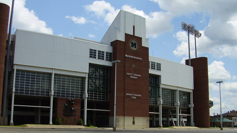 Brick towers and the carved name on the exterior of Joan C. Edwards Stadium in Huntington, West Virginia
