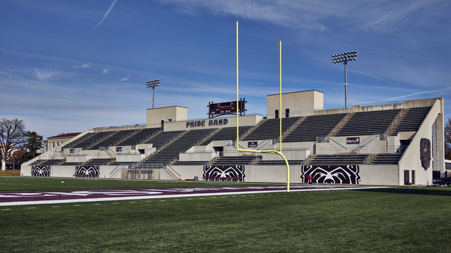 The stands at Robert W. Plaster Stadium in Springfield under a blue sky, seen from the field