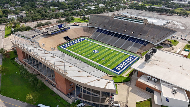 Aerial view of the Rice football stadium in Houston, with the press box, the field and the stadium lots beyond