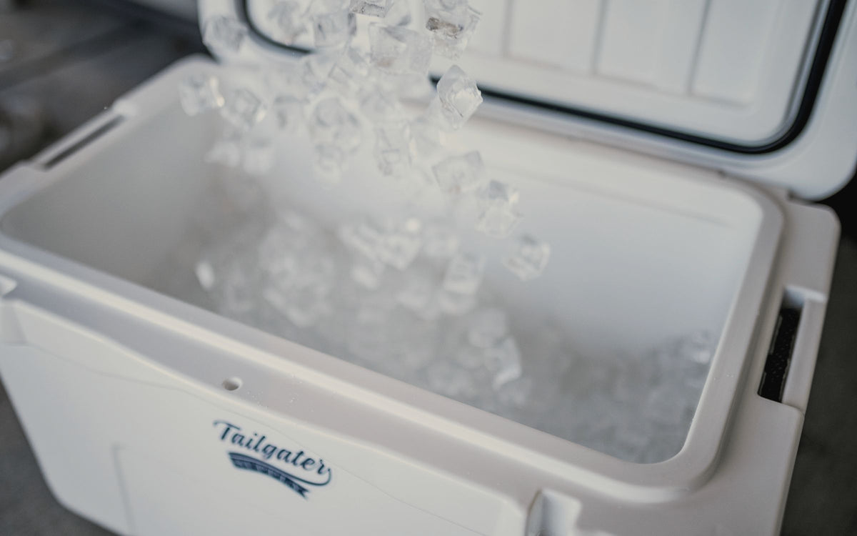 Ice pouring into an open white hard cooler