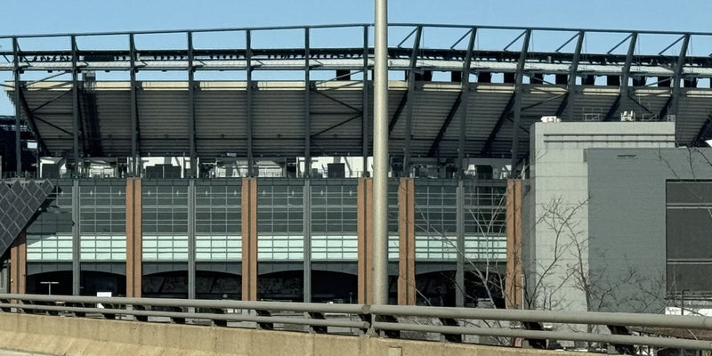 The steel roof trusses and glass concourse of Lincoln Financial Field, seen from Interstate 95 in South Philadelphia
