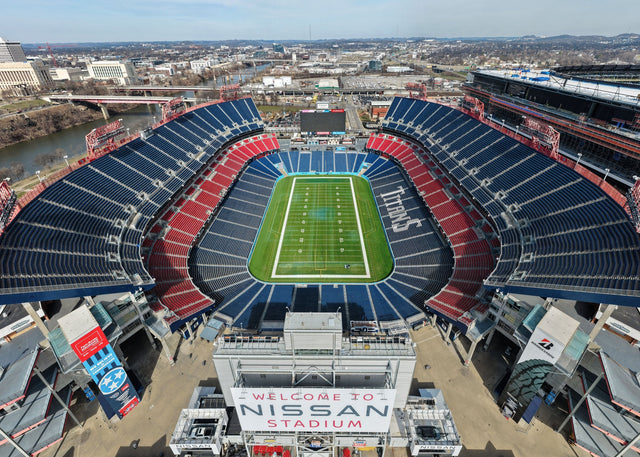 Nissan Stadium in Nashville from above, with the Cumberland River and downtown behind it