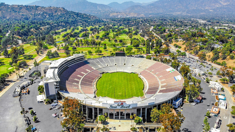 Aerial view of the Rose Bowl in Pasadena with the Brookside golf course and the San Gabriel Mountains behind it