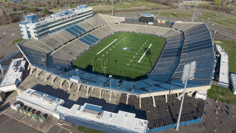 Aerial view of Pratt and Whitney Stadium at Rentschler Field in East Hartford, with the Hartford skyline in the distance