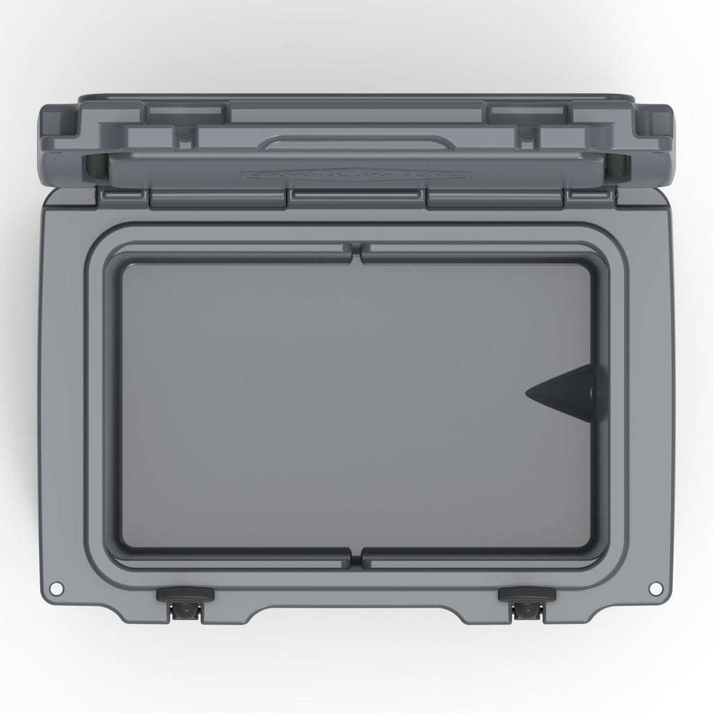 Top-down view into the open charcoal gray hard cooler's empty insulated well