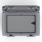 Top-down view into the open charcoal gray hard cooler's empty insulated well
