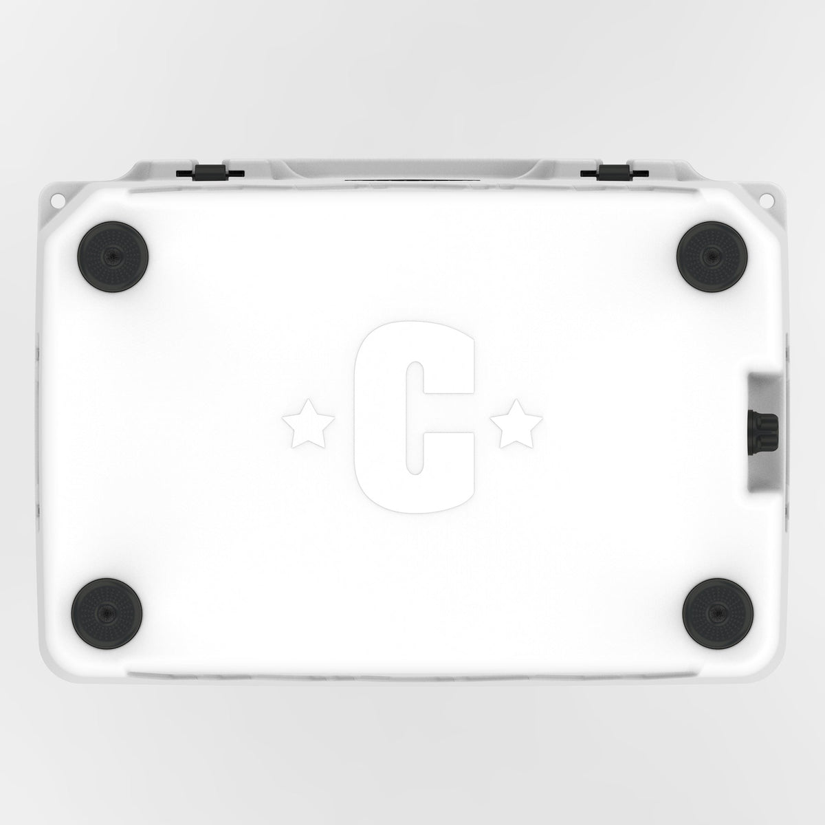 Underside of the white hard cooler with four black rubber feet and a molded C logo