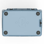 Underside of the slate-blue hard cooler with four rubber feet and a molded C logo