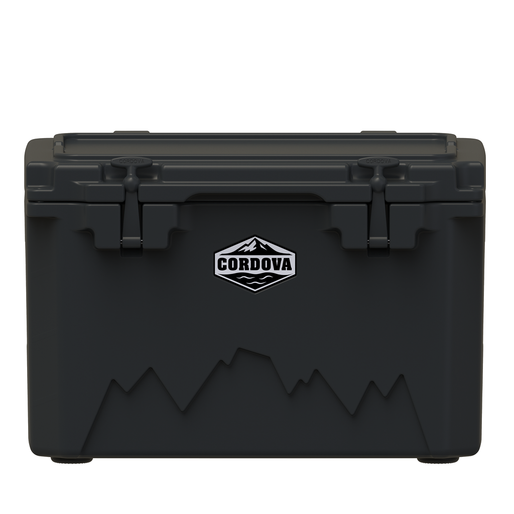 Black hard cooler from the front with two rubber latches, a Cordova badge and a mountain graphic