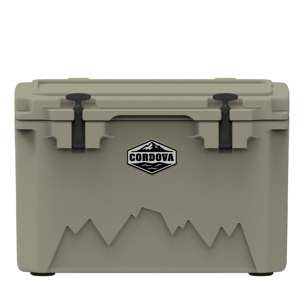 Tan hard cooler from the front, two black rubber latches and a Cordova badge, on black