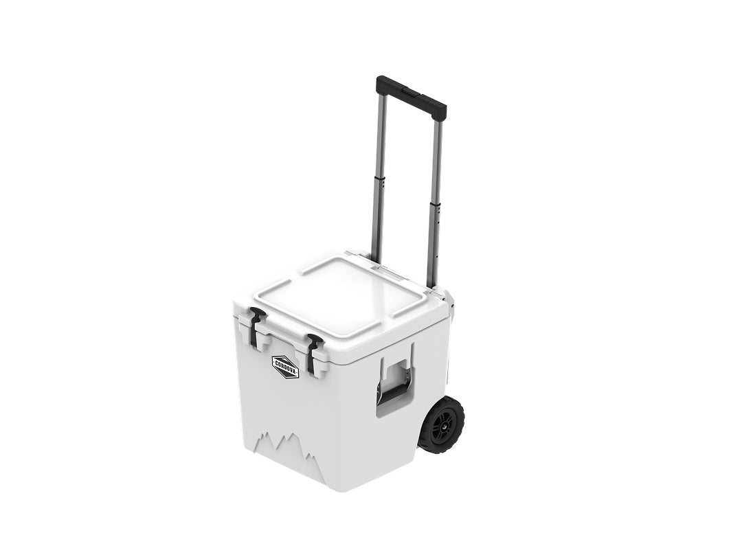 White wheeled cooler from above at an angle, lid closed, handle raised