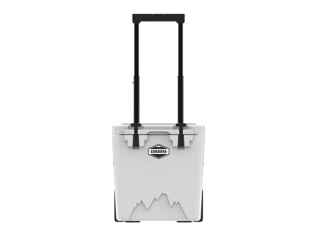 White wheeled hard cooler from the front with its telescoping handle fully raised