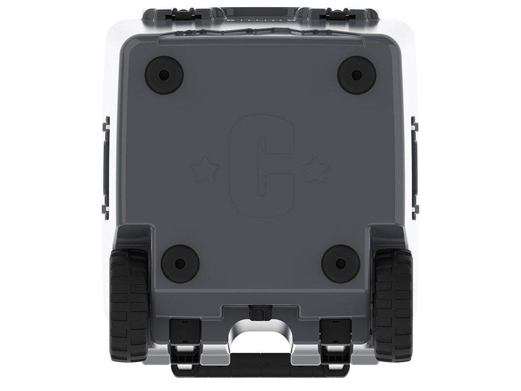Underside of the charcoal gray wheeled cooler showing rubber feet, wheels and a molded C logo