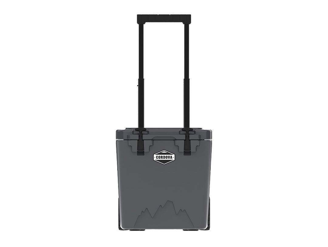Charcoal gray wheeled cooler from the front with its telescoping handle fully raised