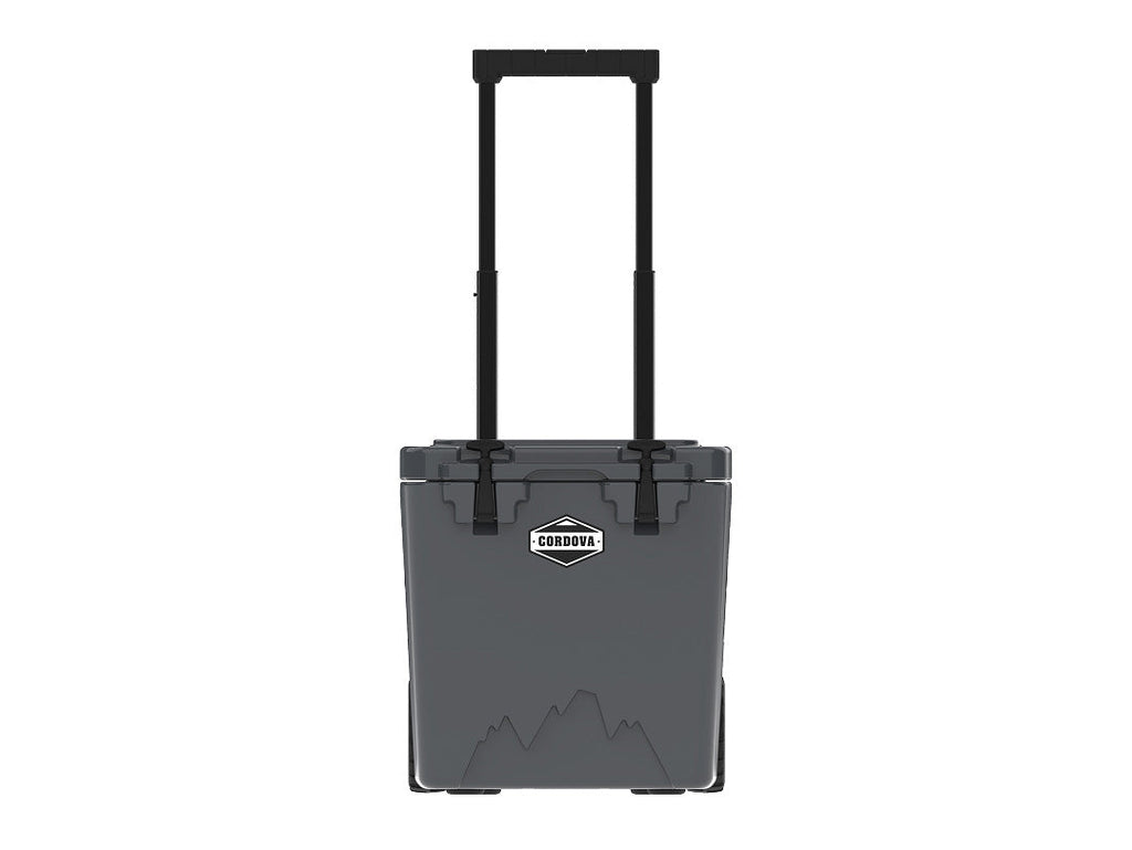 Charcoal gray wheeled cooler from the front, handle raised, on white