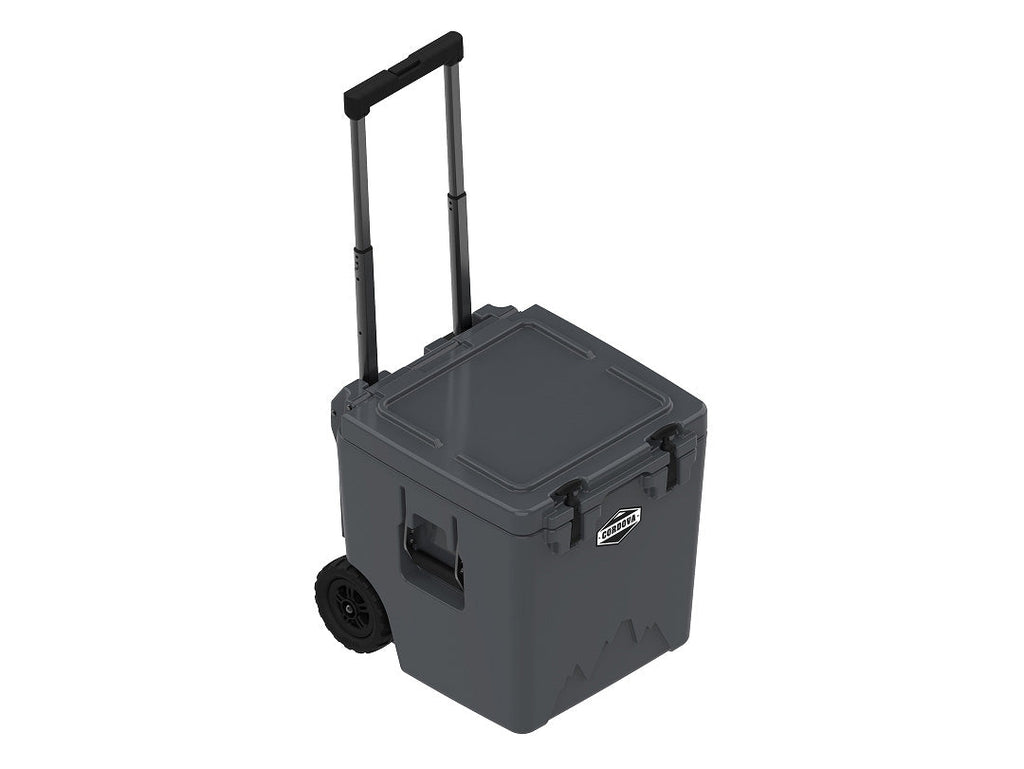 Charcoal gray wheeled cooler at an angle with the handle extended and the lid closed