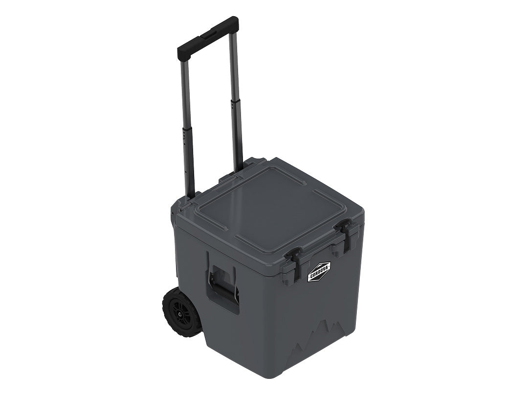 Charcoal gray wheeled cooler at an angle with the handle extended and the lid closed