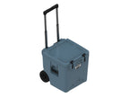 Slate-blue wheeled cooler at an angle with the handle extended and the lid closed