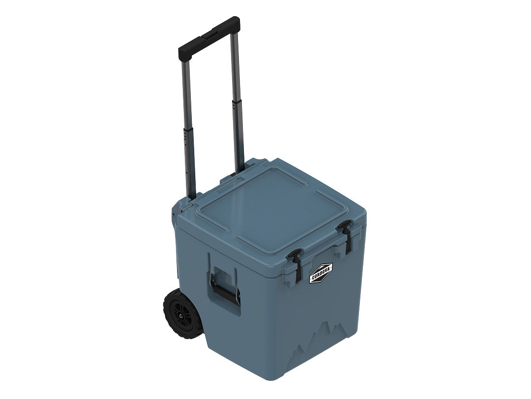 Slate-blue wheeled cooler at an angle with the handle extended and the lid closed