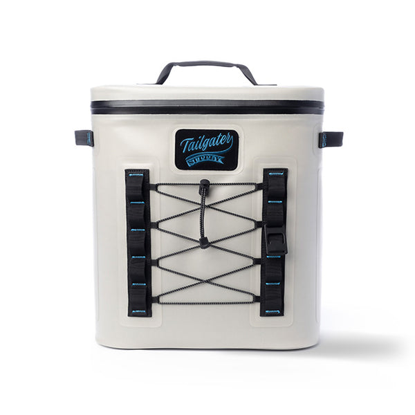 Front of the light gray Tailgate Trekker backpack cooler with bungee lacing and the Tailgater Supply patch