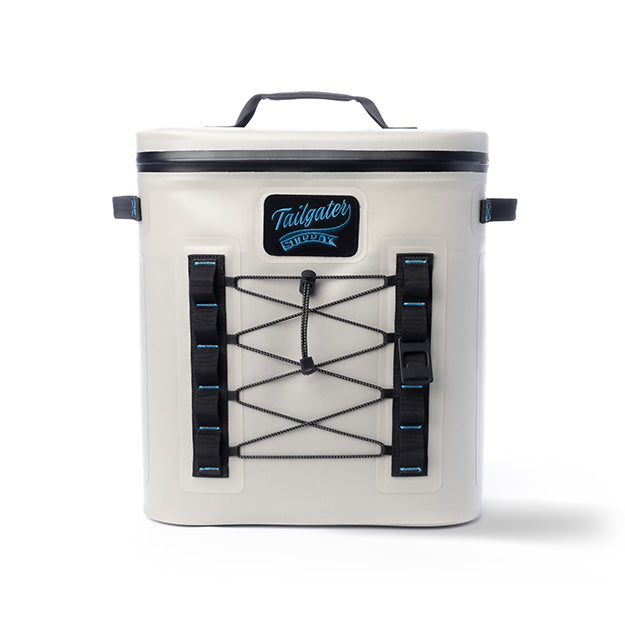 Front of the light gray Tailgate Trekker backpack cooler with bungee lacing and the Tailgater Supply patch