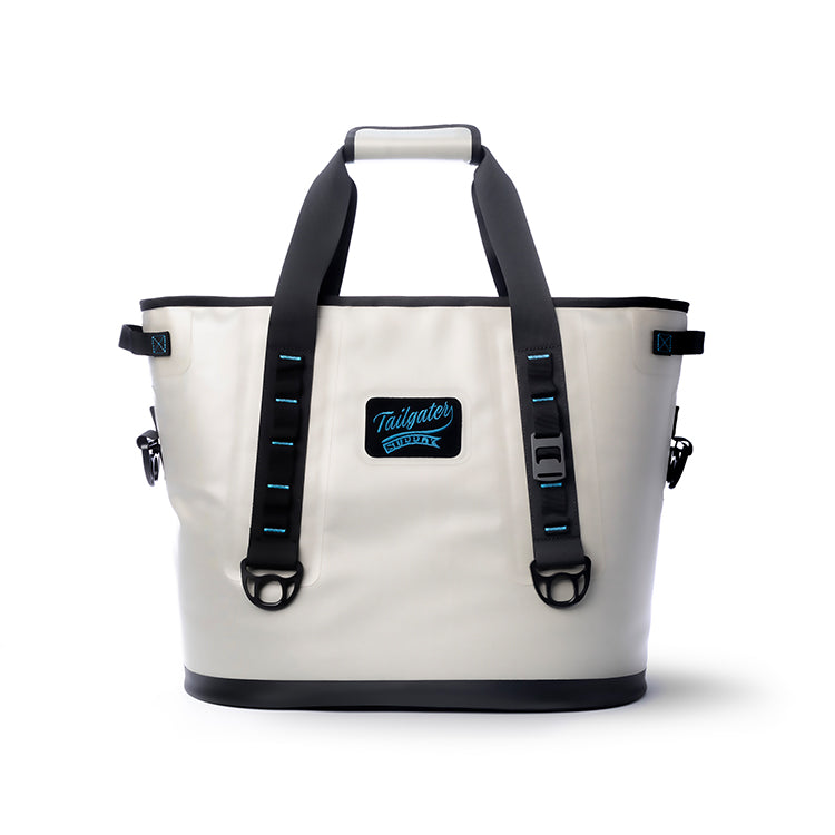 Front of the light gray Tailgate Sidekick soft tote cooler with two carry straps and the Tailgater Supply patch