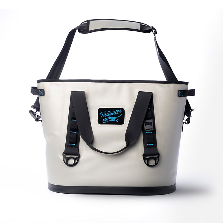 Sidekick tote cooler from the front with its padded shoulder strap raised above the carry handles