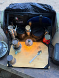 Load image into Gallery viewer, Kitchen bag set up as a coffee station on a picnic table, with a pour-over brewer and a lantern on the board
