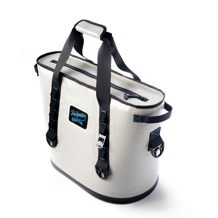Sidekick tote cooler from the front right, showing the zip top, side handle and buckled carry straps