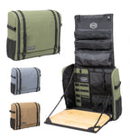 Camp kitchen bag in sage green, gray and brown, closed, beside a sage bag open with its bamboo board folded down