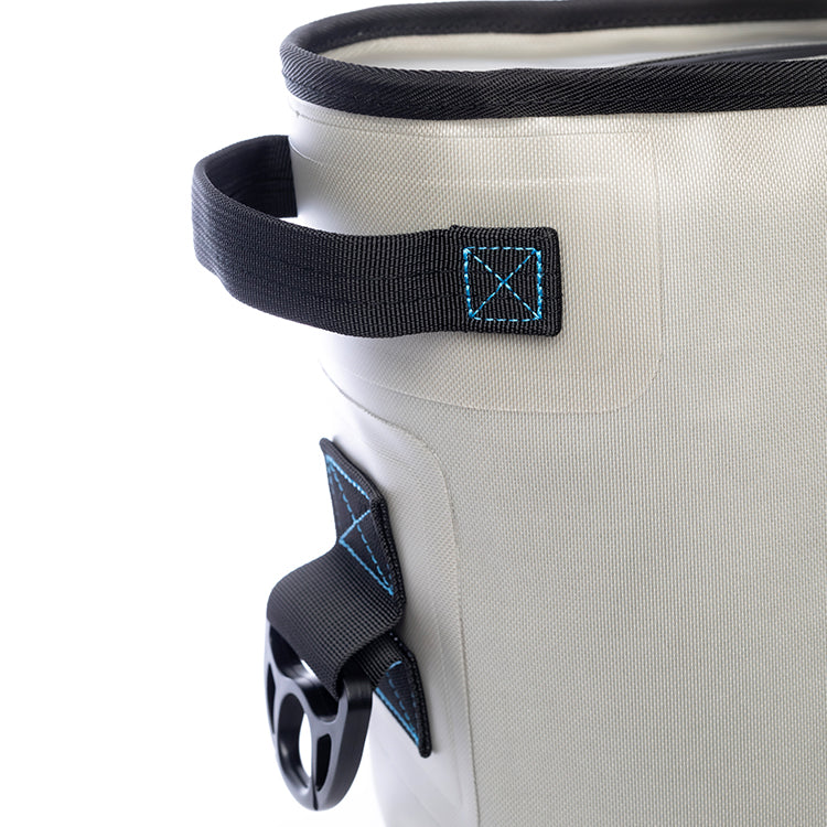 Close-up of a side grab handle and a strap loop on the Sidekick's light gray shell