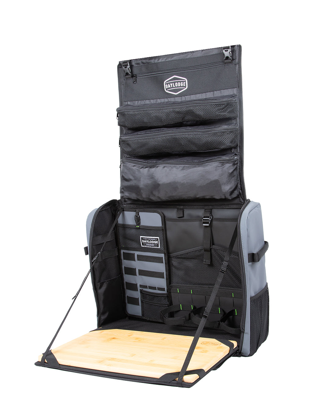 Blue gray kitchen bag fully open, with the lid pockets up and the bamboo board folded out, on white