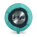 End of the teal DryTunes speaker showing the round metal Yak Power cap